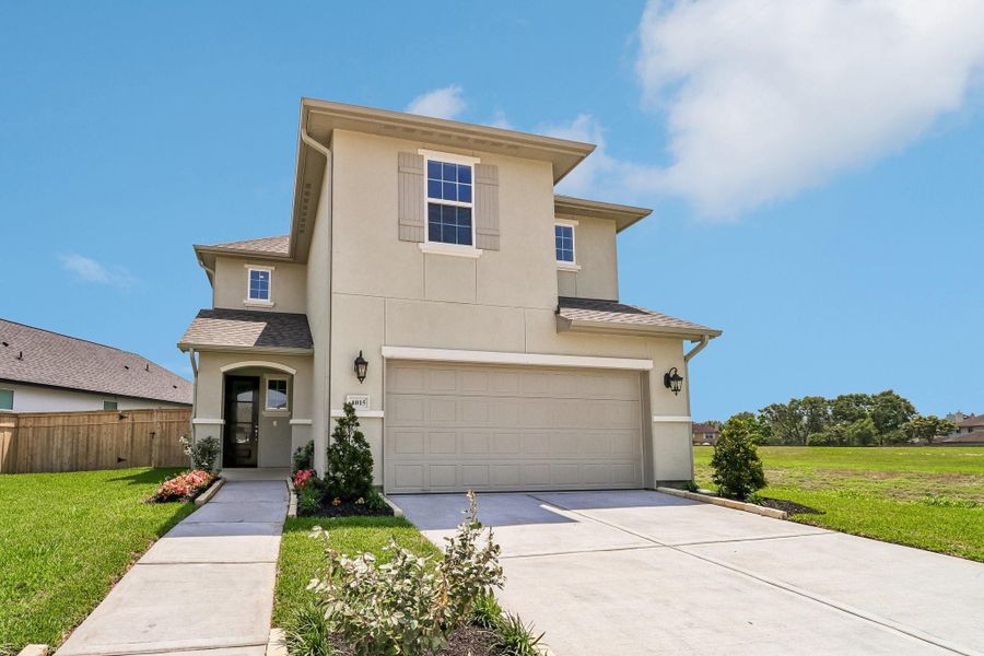 Front exterior of a new home in Sienna 40', Missouri City, TX, highlighting curb appeal (Image 20). Front exterior of a new home in Sienna 40', Missouri City, TX, highlighting curb appeal (Image 20).