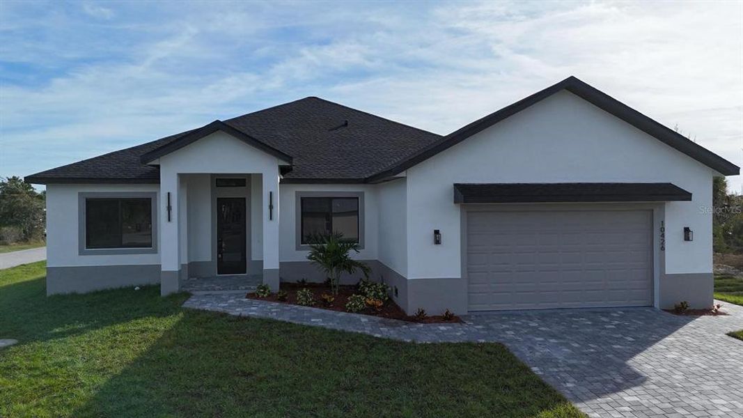 Front exterior of a new home in , Port Charlotte, FL, highlighting curb appeal (Image 32). Front exterior of a new home in , Port Charlotte, FL, highlighting curb appeal (Image 32).