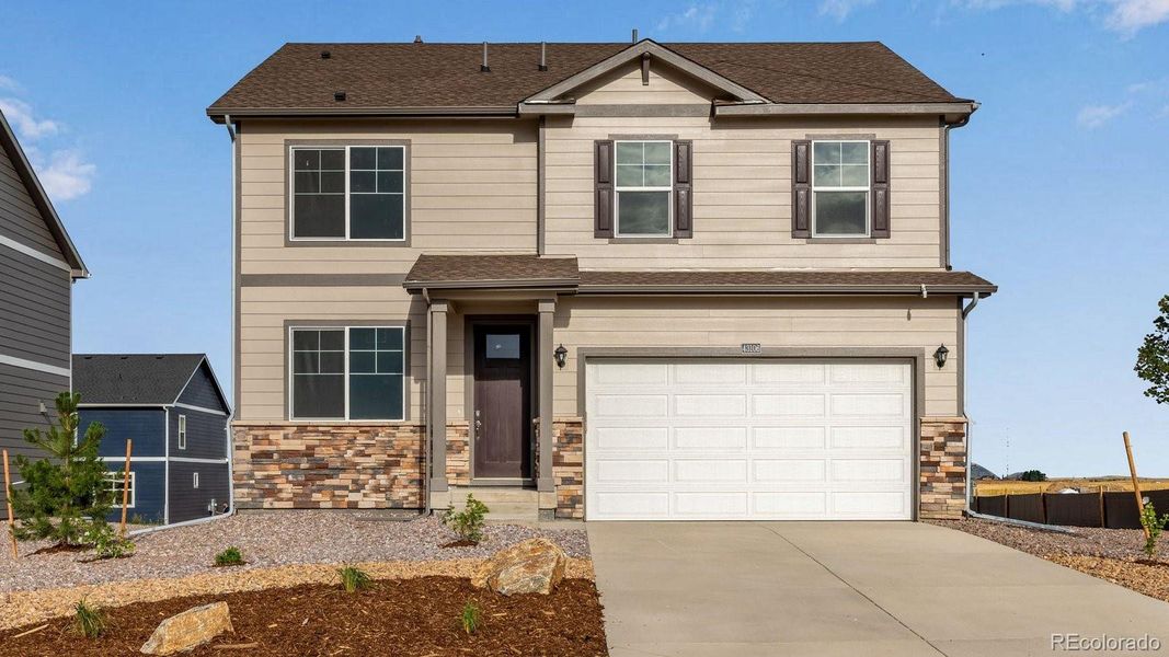 Front exterior of a new home in Spring Valley Ranch, Elizabeth, CO, highlighting curb appeal (Image 2). Front exterior of a new home in Spring Valley Ranch, Elizabeth, CO, highlighting curb appeal (Image 2).