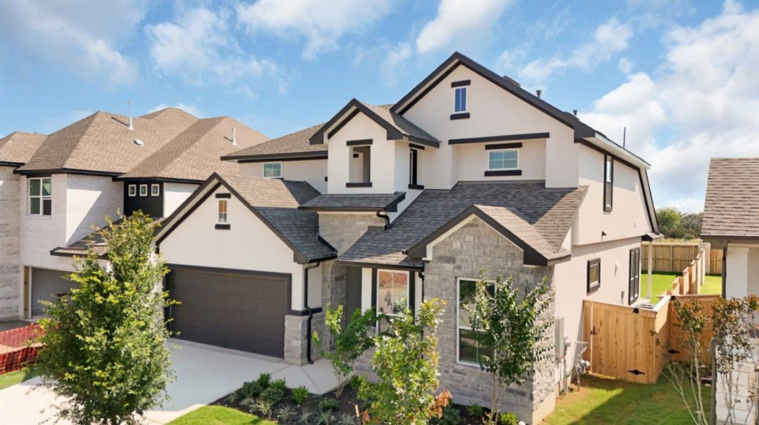 Front exterior of a new home in Lariat, Liberty Hill, TX, highlighting curb appeal (Image 28).