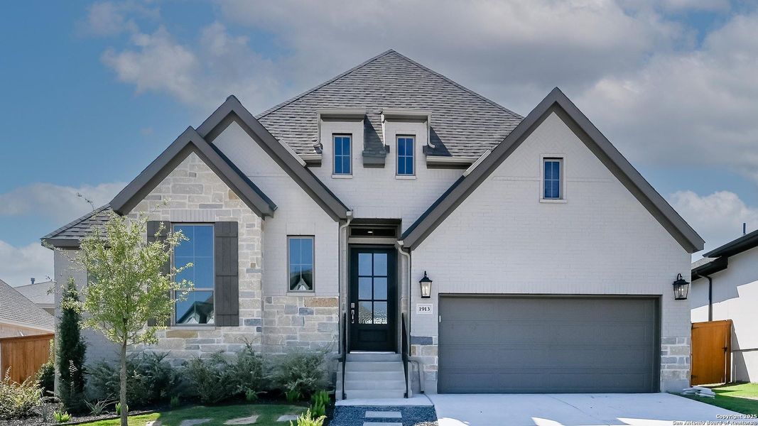 Front exterior of a new home in Veramendi 60', New Braunfels, TX, highlighting curb appeal (Image 22).