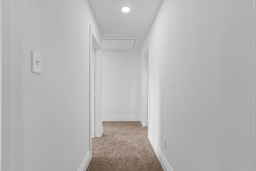 Down the private hallway tucked away from the primary suite are the two guest rooms. Wonderful private guest bedrooms for the little ones, in case of a fire or emergency you are there for them.