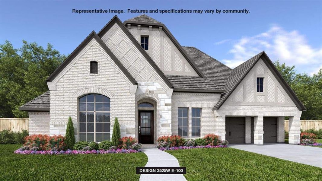 View of front of house with a garage and a front lawn