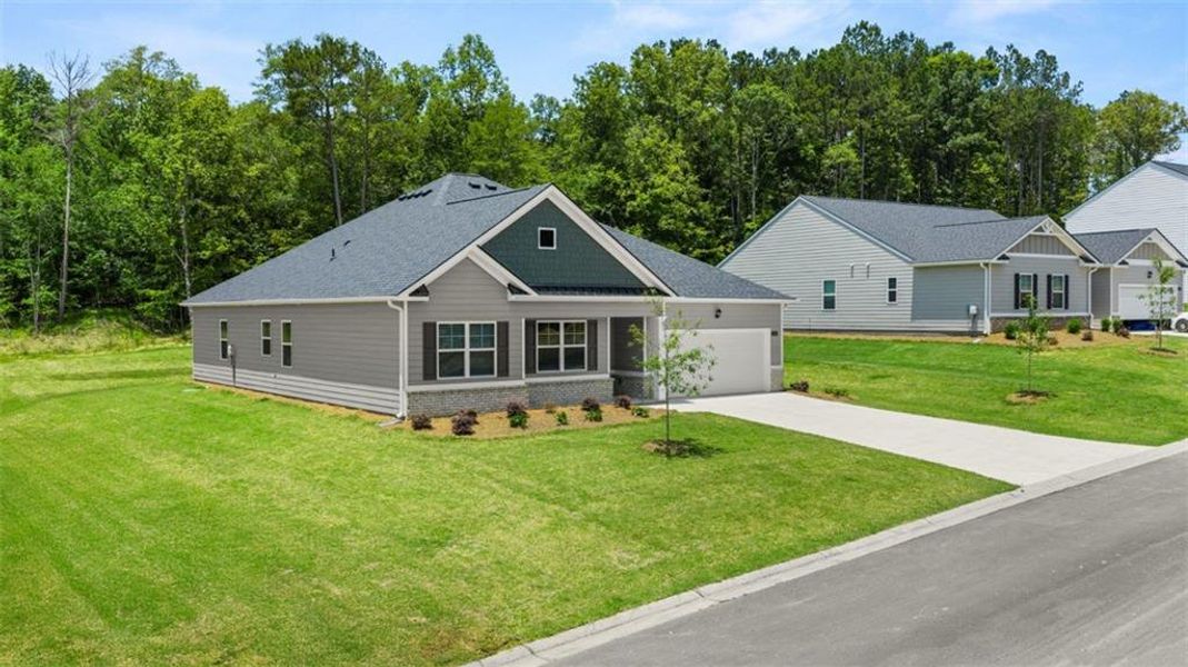 Front exterior of a new home in Kingston Ranch at Lake Oconee, Buckhead, GA, highlighting curb appeal (Image 24). Front exterior of a new home in Kingston Ranch at Lake Oconee, Buckhead, GA, highlighting curb appeal (Image 24).