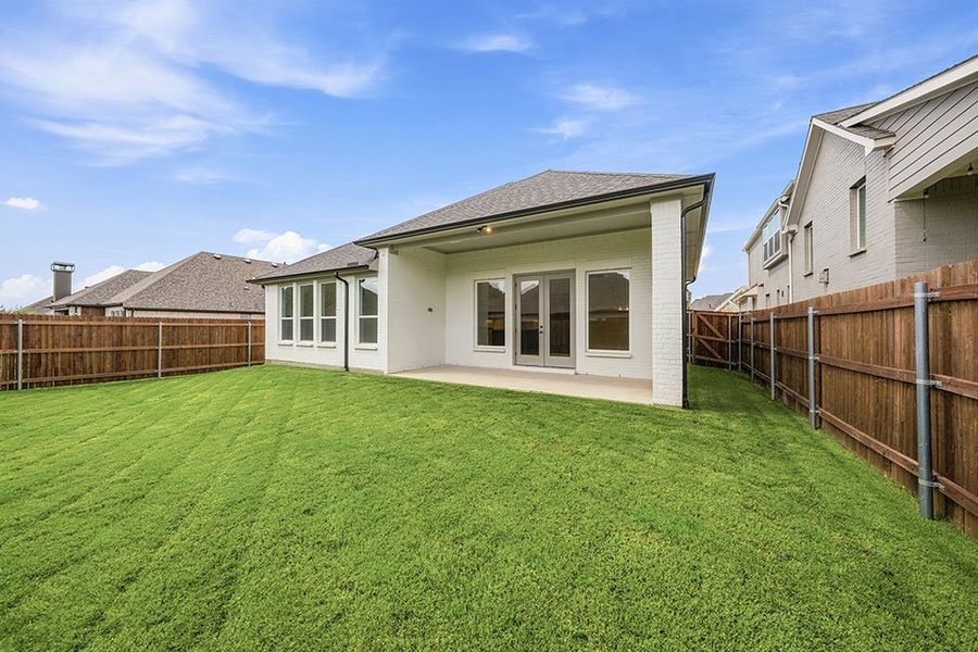 Exterior details and patio area of a home in Tavolo Park, Fort Worth (Image 4).
