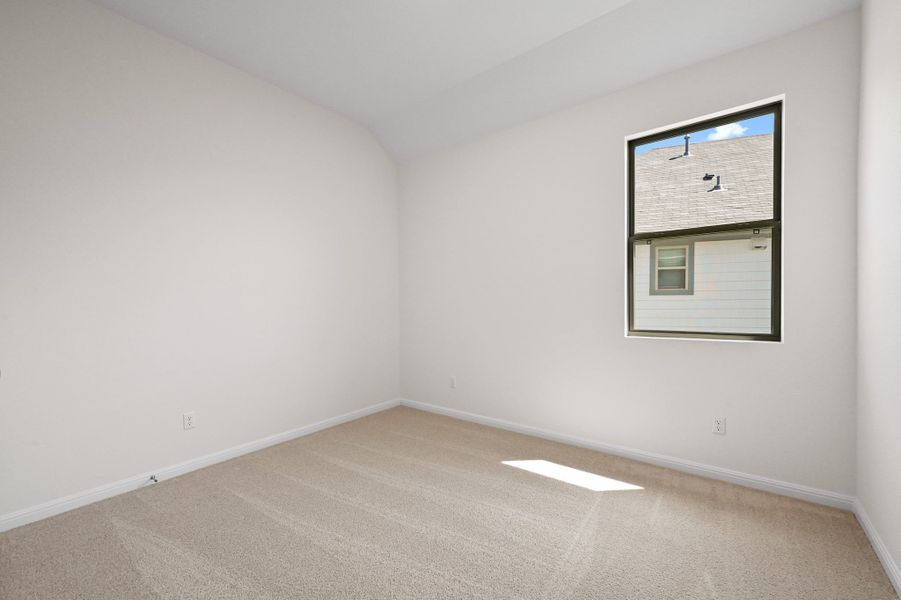 Bedroom in the Cedar home plan by Trophy Signature Homes – REPRESENTATIVE PHOTO