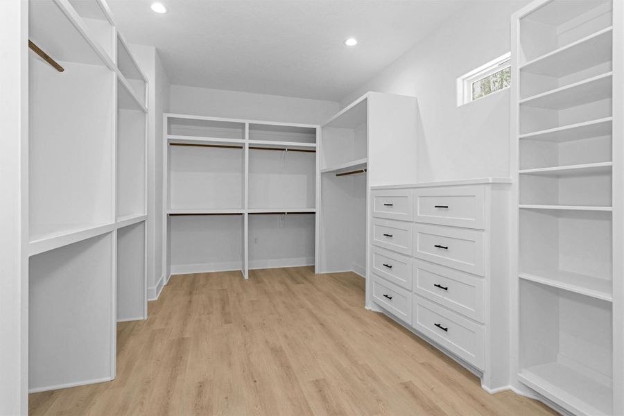 Large master closet loaded with built ins.