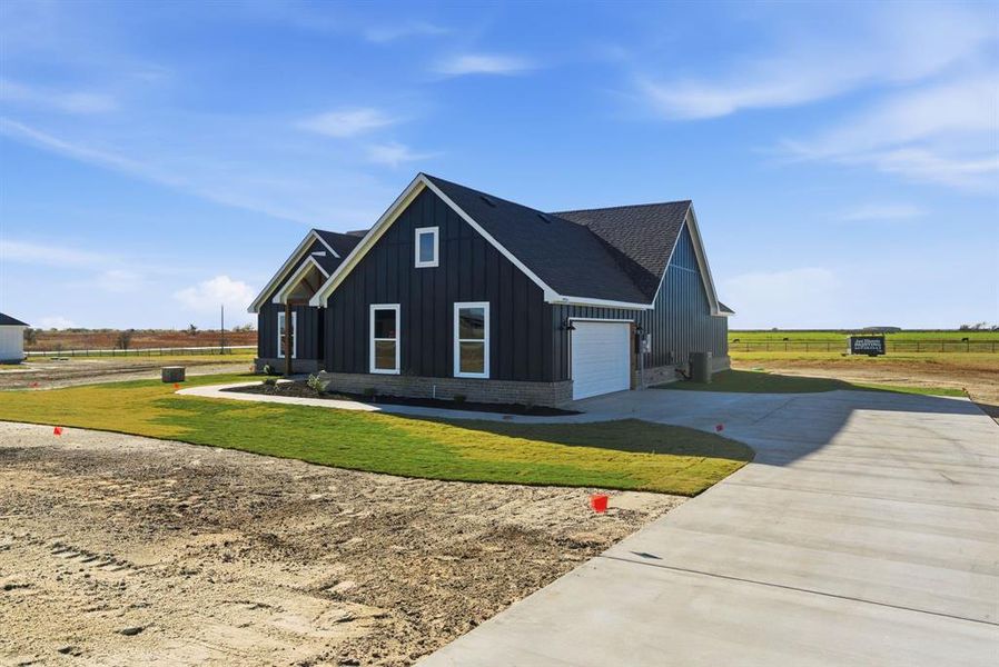 Front exterior of a new home in , Cresson, TX, highlighting curb appeal (Image 2). Front exterior of a new home in , Cresson, TX, highlighting curb appeal (Image 2).