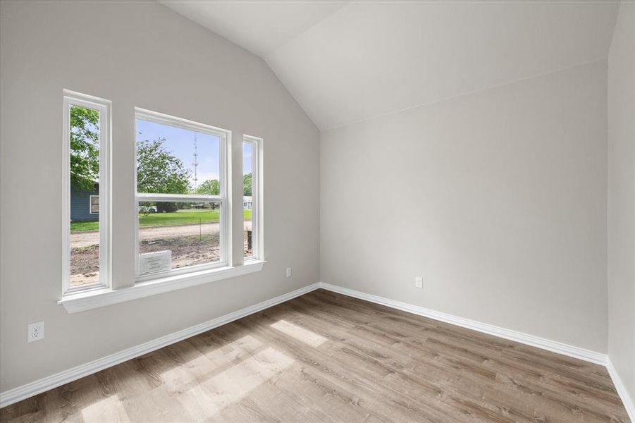 Vaulted ceilings complement the wood-finish flooring