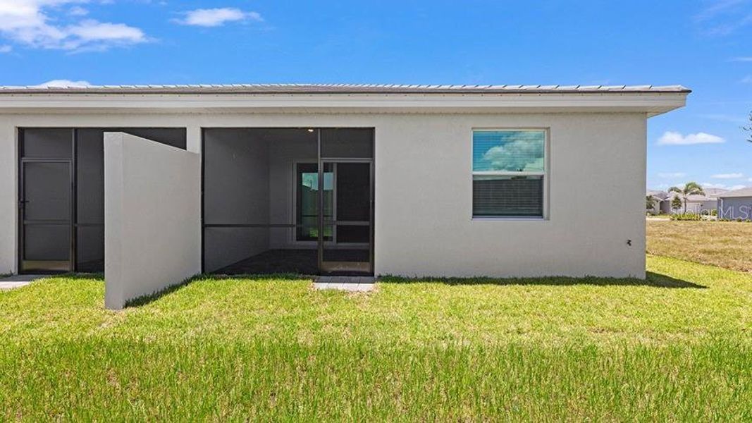 Exterior details and patio area of a home in Palm Lake at Coco Bay, Englewood (Image 18).