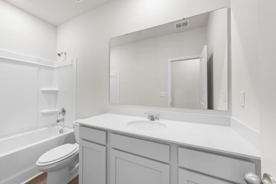 Furnished interior view inside a new home in Blue Heron Retreat, Little River (Image 4).