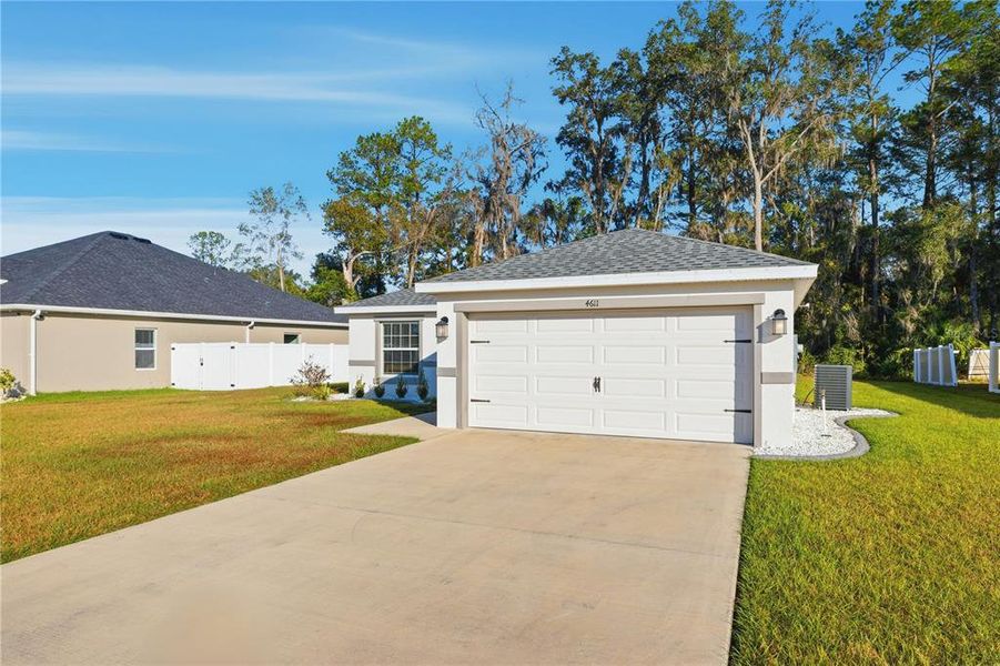 Front exterior of a new home in , Ocala, FL, highlighting curb appeal (Image 25).