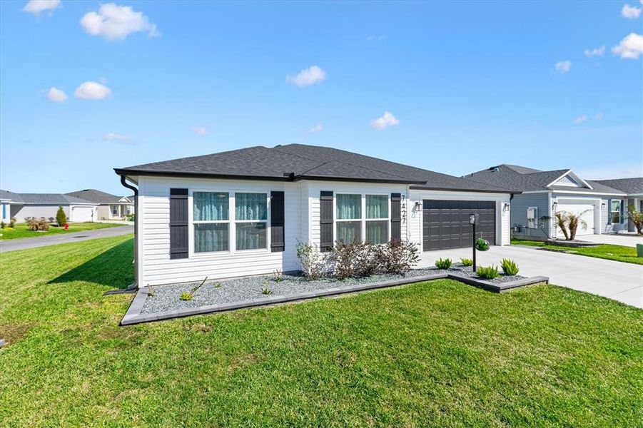 Front exterior of a new home in , The Villages, FL, highlighting curb appeal (Image 21).