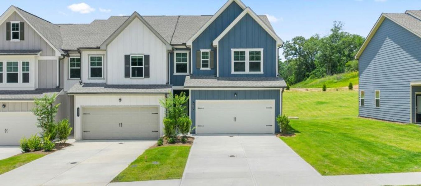 Front exterior of a new home in Milledge Commons, Milledgeville, GA, highlighting curb appeal (Image 1).