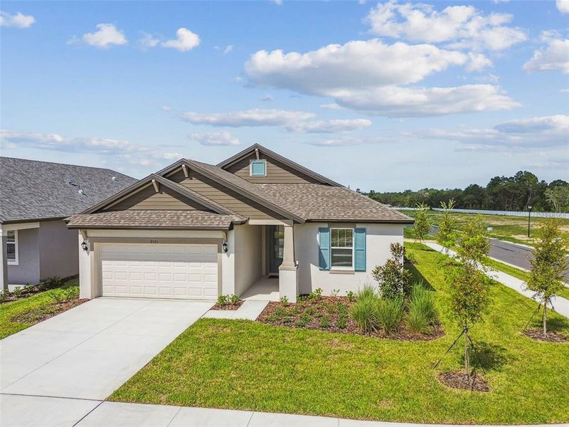 Front exterior of a new home in Pinecone Reserve, Brooksville, FL, highlighting curb appeal (Image 13). Front exterior of a new home in Pinecone Reserve, Brooksville, FL, highlighting curb appeal (Image 13).