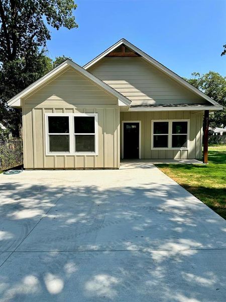 View of front of house with board and batten siding