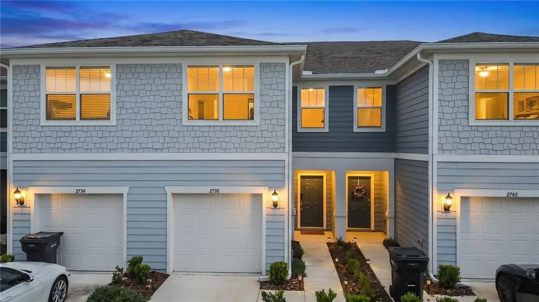 Front exterior of a new home in , Davenport, FL, highlighting curb appeal (Image 24). Front exterior of a new home in , Davenport, FL, highlighting curb appeal (Image 24).