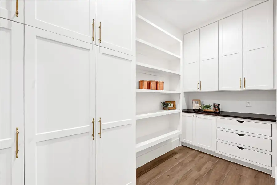 Custom closet with abundant storage, efficient organization, and maximized space.