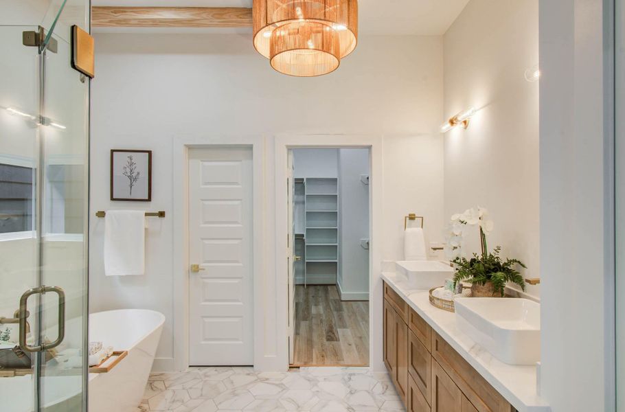 Gorgeous primary spa-like oasis bath. Dual vanities. With plenty of light and privacy. For added luxury, the celling over the soaking tub is vaulted in 2213 Bevis.