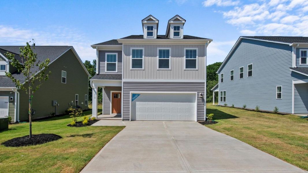 Representative exterior photo of a completed home built from the Jasmine by DRB Homes in Farms at Bellingham, Mooresville, NC (Image 6). Representative exterior photo of a completed home built from the Jasmine by DRB Homes in Farms at Bellingham, Mooresville, NC (Image 6).