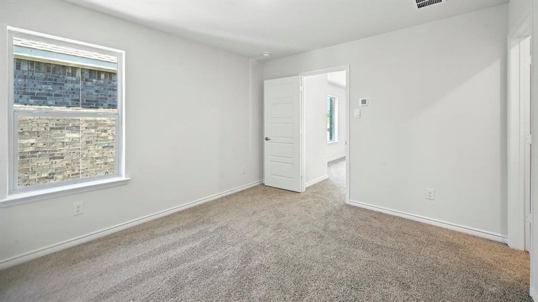 Spare room with carpet floors and baseboards