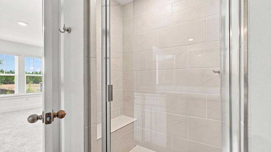 Notable primary bath featuring a walk-in shower and tasteful design touches throughout in Fountain Inn, SC Notable primary bath featuring a walk-in shower and tasteful design touches throughout in Fountain Inn, SC