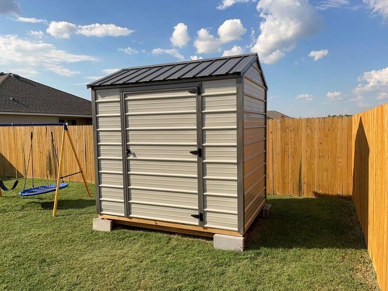 View of shed featuring a fenced backyard