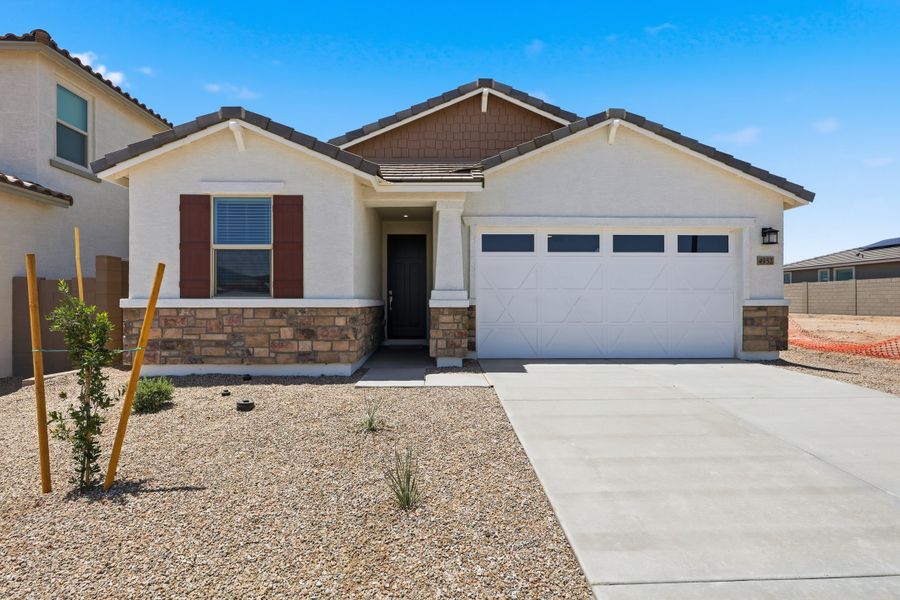 Front exterior of a new home in Montana Vista - Highland, Buckeye, AZ, highlighting curb appeal (Image 1). Front exterior of a new home in Montana Vista - Highland, Buckeye, AZ, highlighting curb appeal (Image 1).