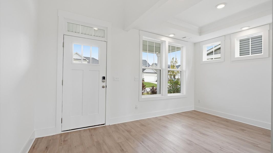 Superior design begins at the front door with a hardwood floor foyer and elegant sightlines in Moore, SC