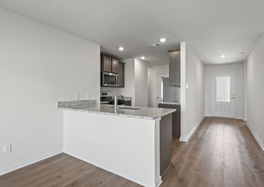The kitchen has a wonderful breakfast bar.