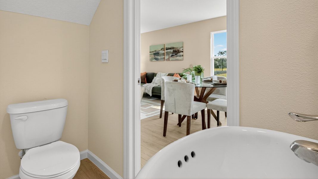 Representative furnished interior of a home built from the GREYSON II by D.R. Horton in Trout River, Jacksonville (Image 10).