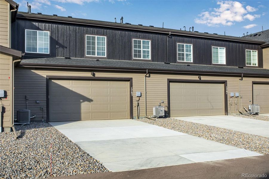 Exterior details and patio area of a home in Westside Crossing Townhomes, Berthoud (Image 4).