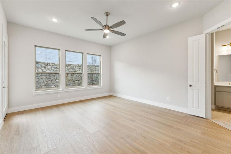 Unfurnished room with a ceiling fan, light wood-style flooring, and recessed lighting