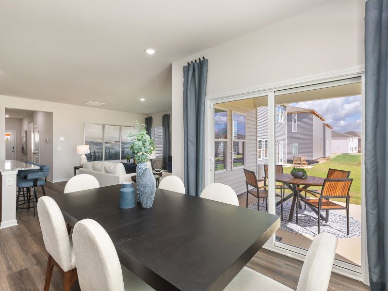 Dining area in the Chandler floorplan at a Meritage Homes community in Angier, NC.