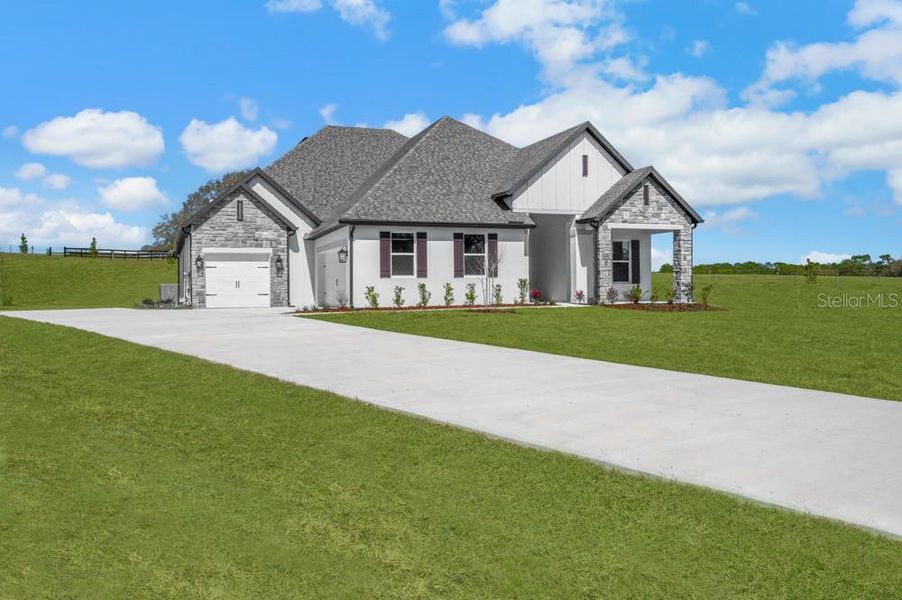 Front exterior of a new home in , Fruitland Park, FL, highlighting curb appeal (Image 24).