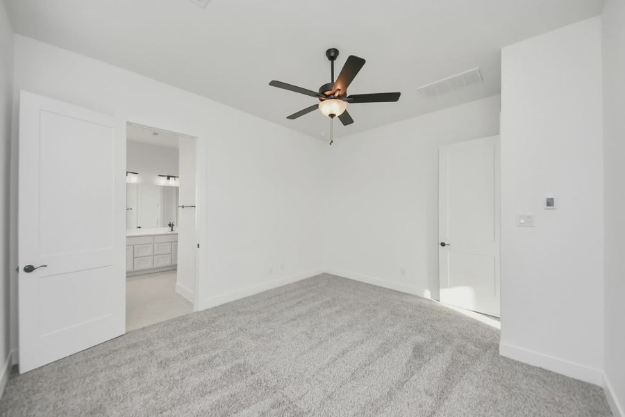 Representative unfurnished interior of a home built from the Bonneville by Chesmar Homes in Meridiana 50's and 60's, Manvel (Image 36).