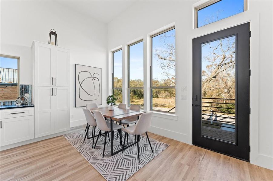 Spacious dining room area with lots of natural light.