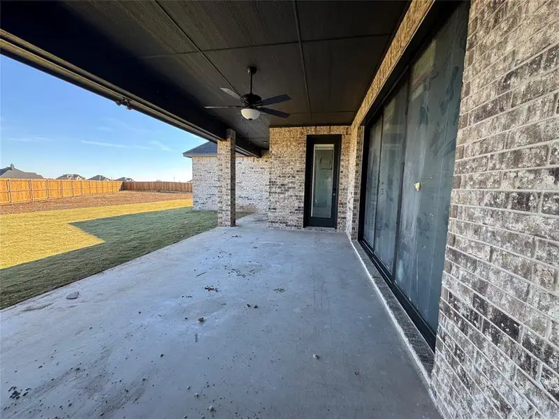 Exterior details and patio area of a home in Coyote Crossing, Godley (Image 2).