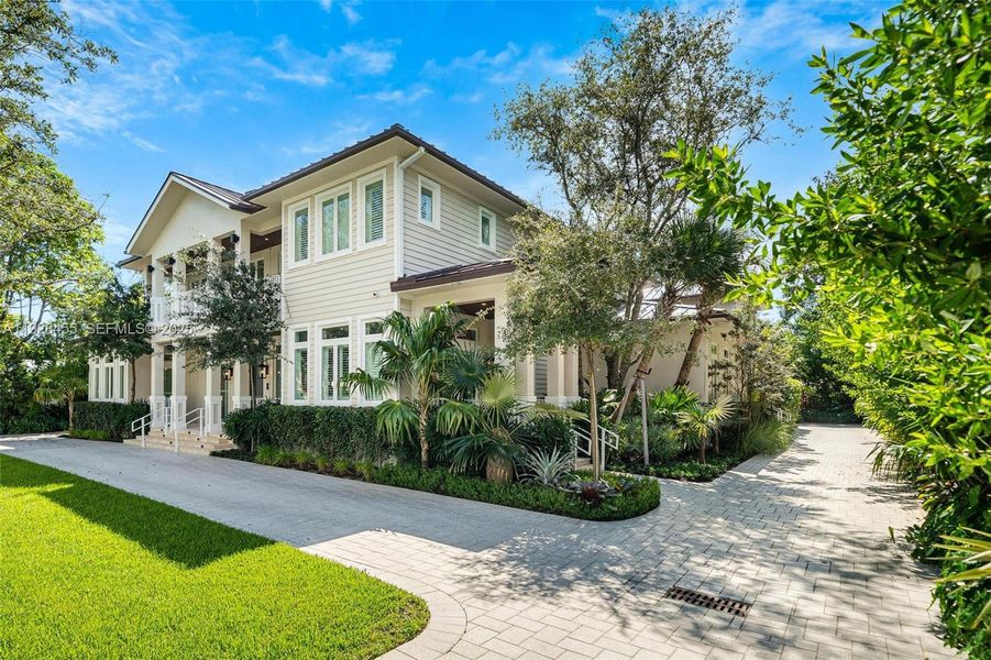 Front exterior of a new home in , Pinecrest, FL, highlighting curb appeal (Image 2). Front exterior of a new home in , Pinecrest, FL, highlighting curb appeal (Image 2).