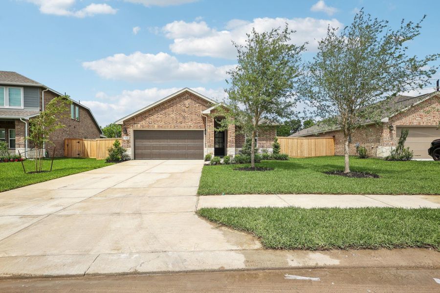 Front exterior of a new home in Massey Oaks - Premier Series, Pearland, TX, highlighting curb appeal (Image 2).
