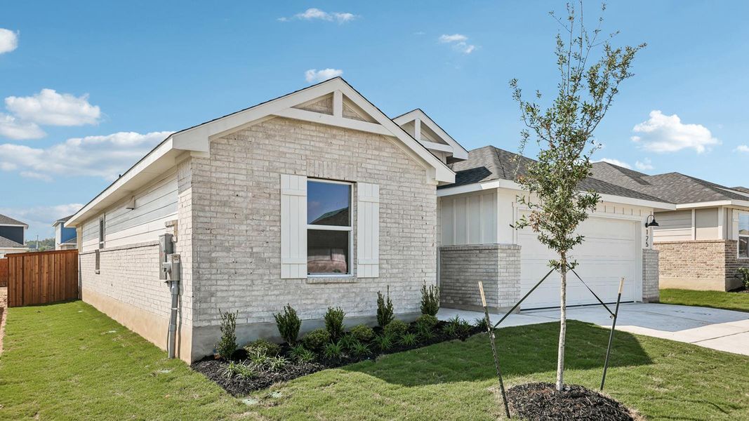 Front exterior of a new home in Thunder Rock, Marble Falls, TX, highlighting curb appeal (Image 1). Front exterior of a new home in Thunder Rock, Marble Falls, TX, highlighting curb appeal (Image 1).