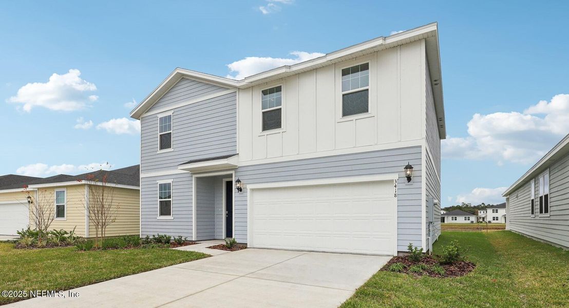 Front exterior of a new home in Lakes at Bella Lago - Signature Series, Green Cove Springs, FL, highlighting curb appeal (Image 2). Front exterior of a new home in Lakes at Bella Lago - Signature Series, Green Cove Springs, FL, highlighting curb appeal (Image 2).
