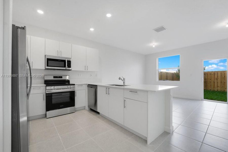 Furnished interior view inside a new home in , Homestead (Image 7). Furnished interior view inside a new home in , Homestead (Image 7).