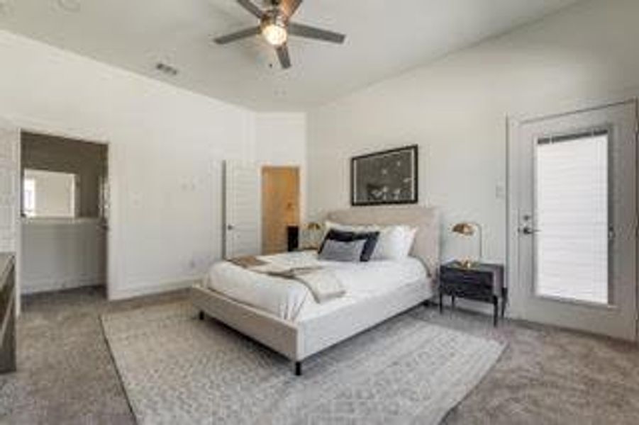 Carpeted bedroom with ceiling fan