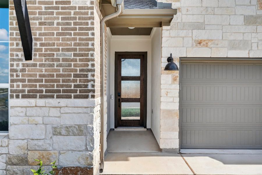 Exterior details and patio area of a home in Lariat, Liberty Hill (Image 3).