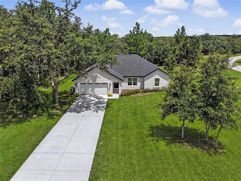 Front exterior of a new home in , Dunnellon, FL, highlighting curb appeal (Image 27). Front exterior of a new home in , Dunnellon, FL, highlighting curb appeal (Image 27).