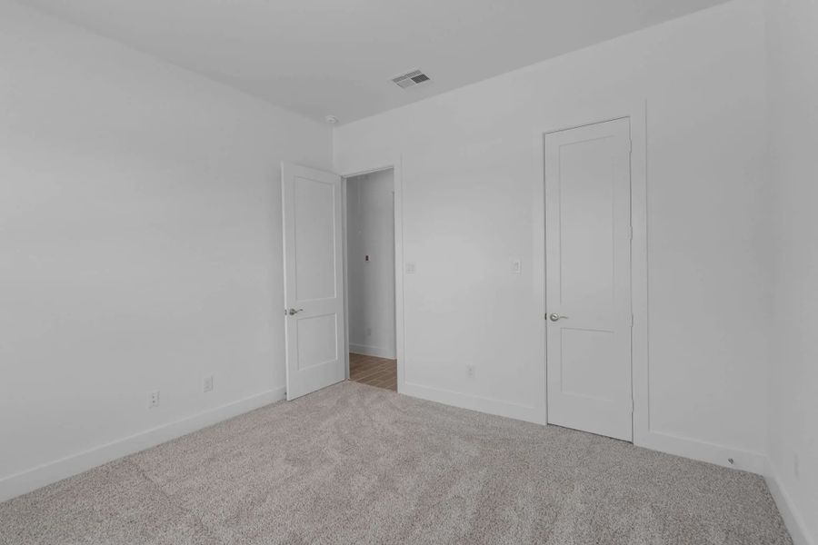 Representative unfurnished interior of a home built from the Mickelson by Chesmar Homes in Riceland Alley Loads, Mont Belvieu (Image 86).
