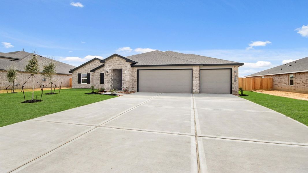 Front exterior of a new home in Riverside Estates, Mont Belvieu, TX, highlighting curb appeal (Image 16).