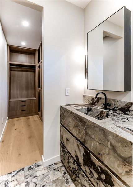 Bathroom with vanity, recessed lighting, and light wood-style floors