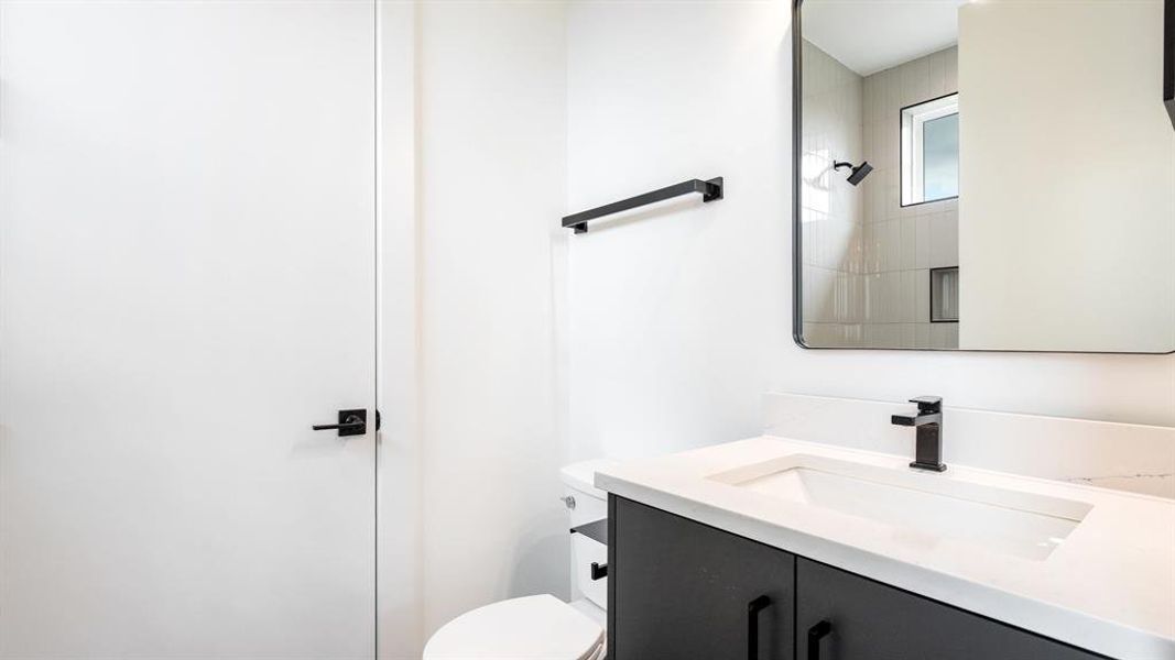 Bathroom featuring toilet and vanity